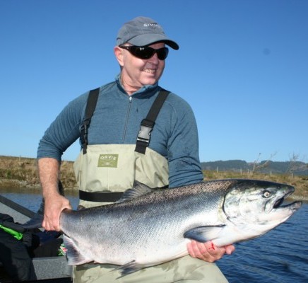 Bob Gaines with a chrome bright Smith River king salmon caught with guide Andy Martin of Wild Rivers Fishing.