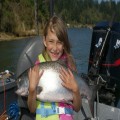 Alexandra Martin with her first ever king, caught in 2011 in Coquille Bay.